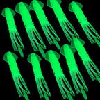 Green squid-shaped glow sticks on a black background
