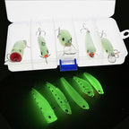 Set of fishing lures in a clear case with one lure outside on a black background