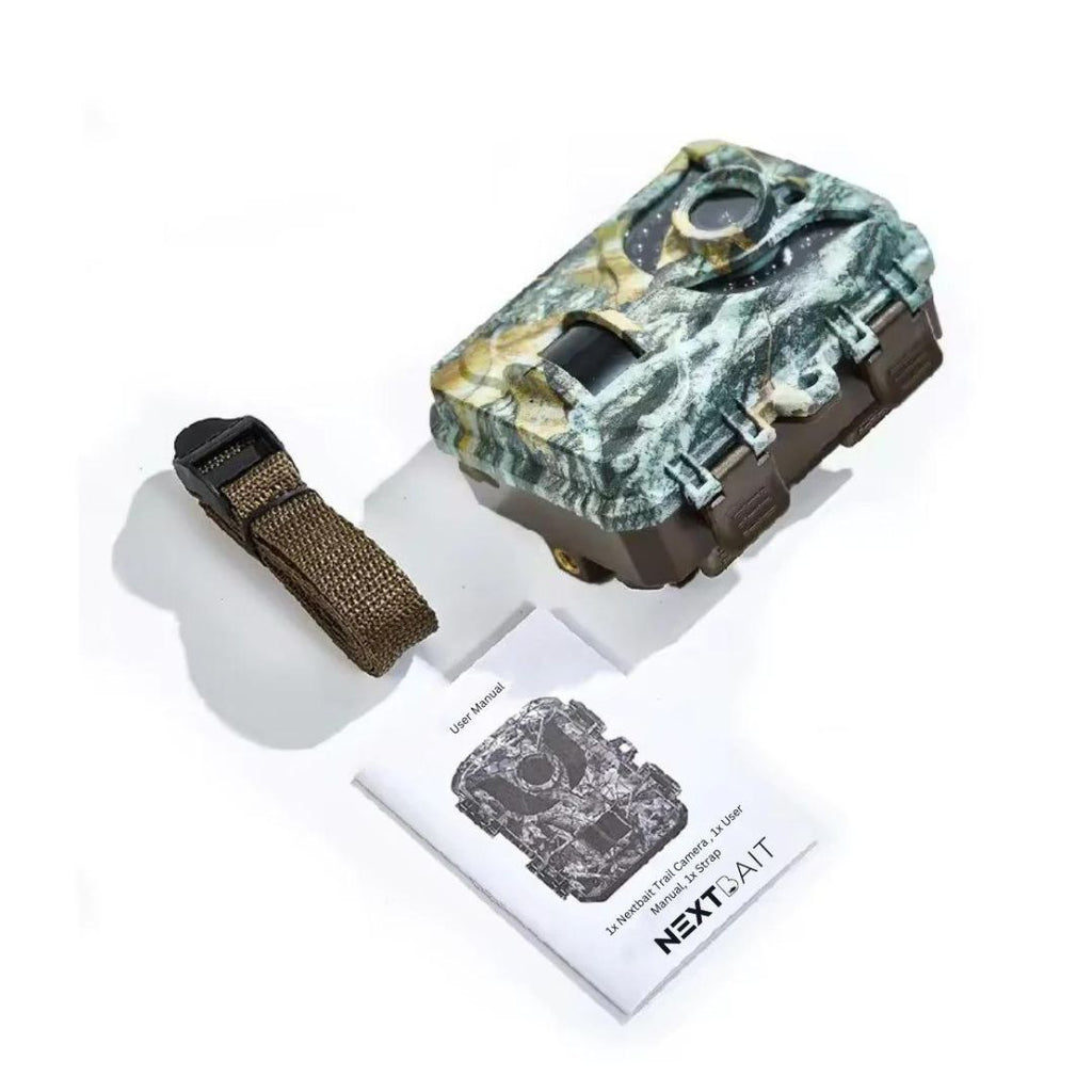 Compact and discreet, the outdoor expert mini trail camera with camouflage design is perfectly poised in natural surroundings, complete with a user-friendly manual by NEXTxTIAIT, ready to capture the hidden wonders of wildlife.