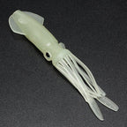Transparent fishing lure shaped like a squid on a dark background