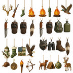 Close-up view of all 24 hunting and wilderness-themed acrylic ornaments, including antlers, rifle, campfire, duck, hunting knife, bear paws, wolf head, binoculars, boots, eagle, camouflage stocking, US flag, dog, tent, and deer.