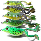 Set of 5 lifelike frog fishing lures with realistic colors, red eyes, and soft legs designed to attract bass, pike, and other freshwater fish.