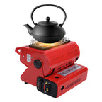 Black teapot on a red portable stove with a white background